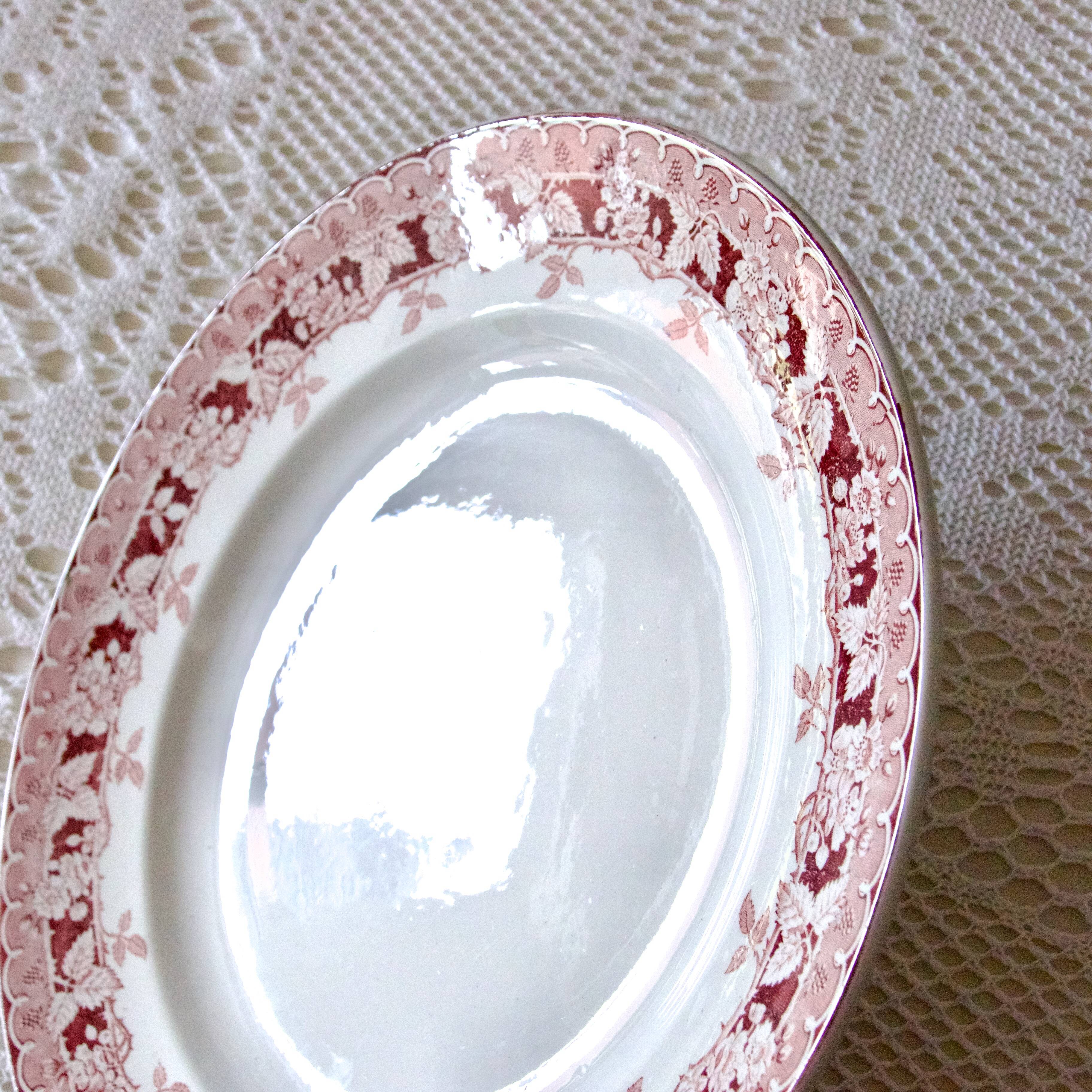 Large old round dish St Amand iron earth "mulberry"