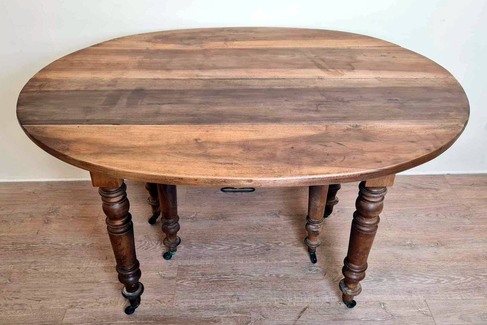 Louis Philippe period 6-legged extending table in solid walnut