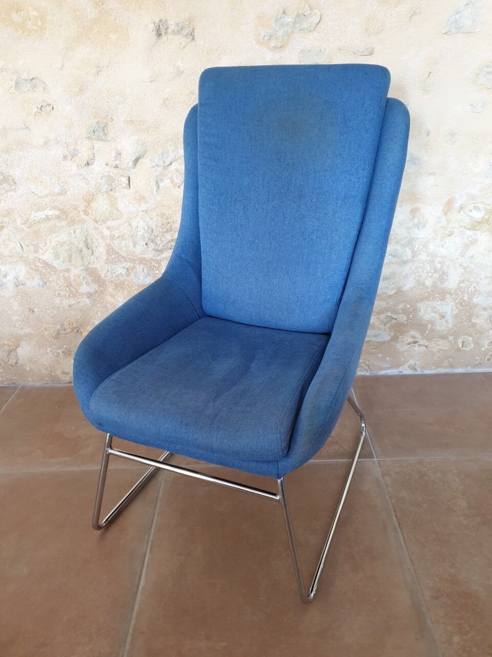 Armchair and its footrest