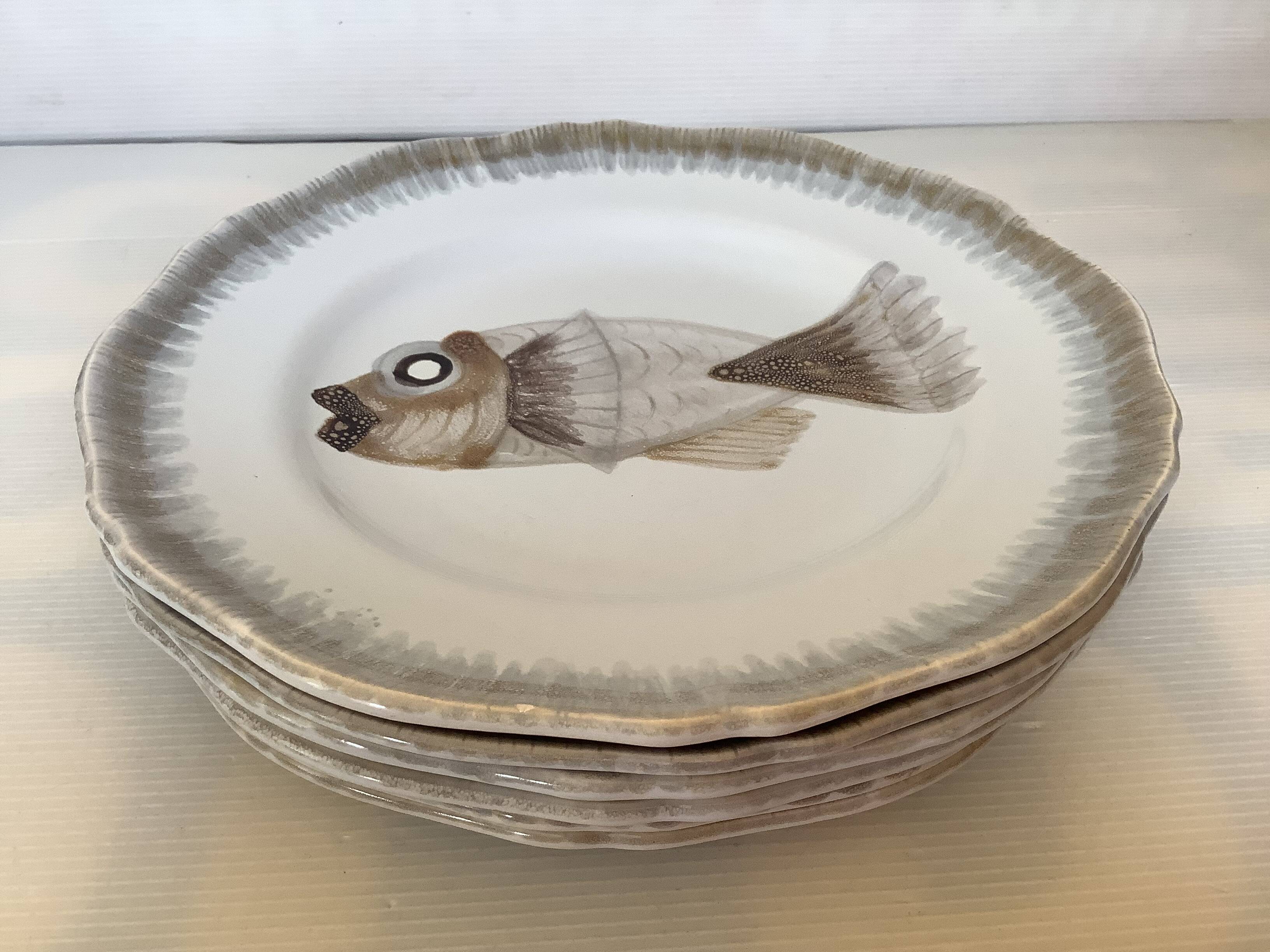 Six hand-decorated fish plates.