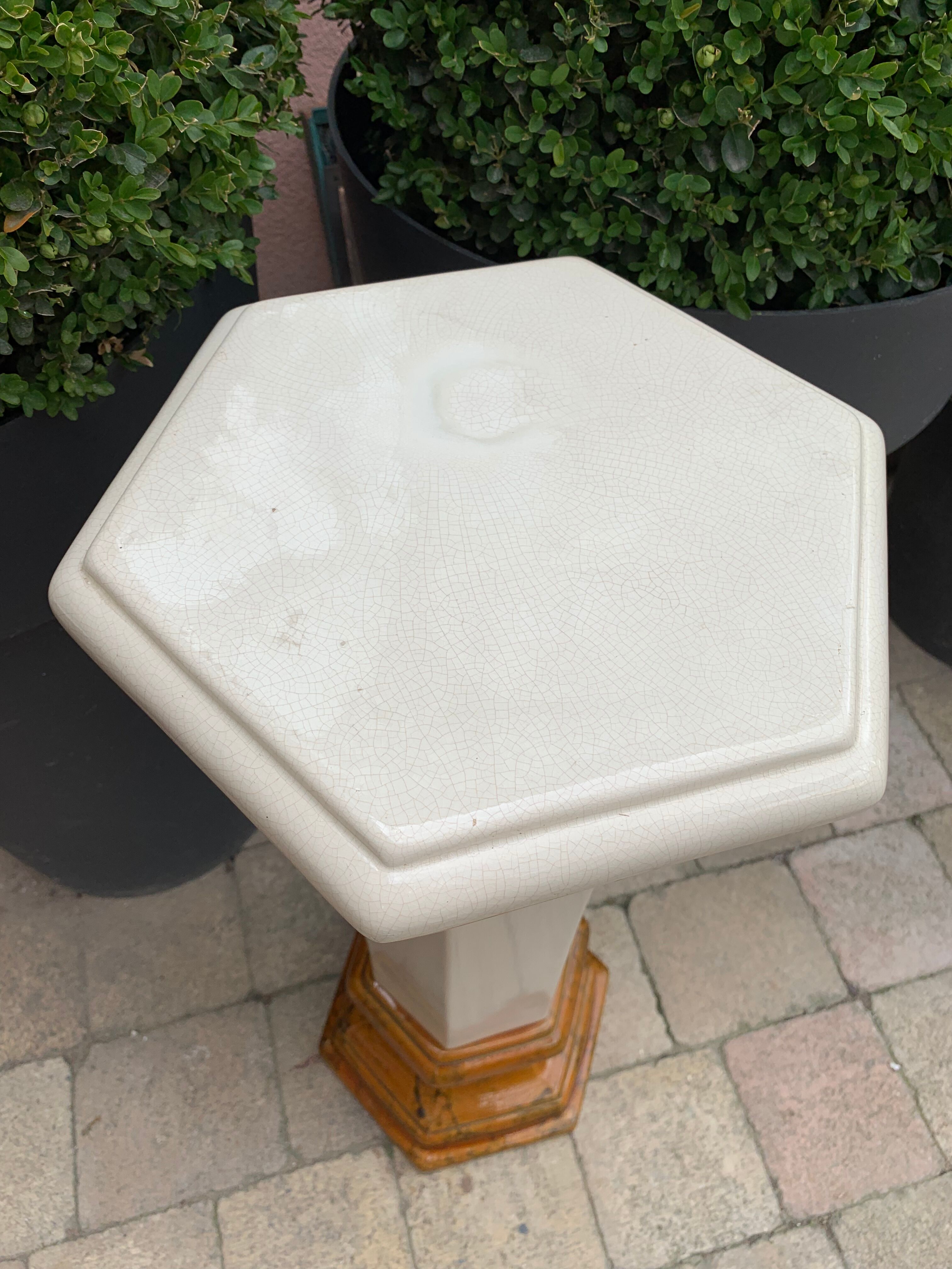 Column wears vintage plant