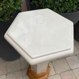 Column wears vintage plant