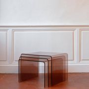 Vintage trio of nesting tables in smoked plexiglass by Michel Dumas, year.