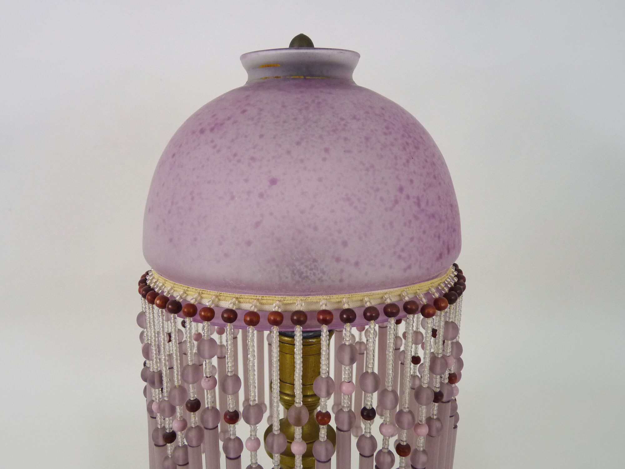 Table lamp, bedside lamp, speckled pink globe and glass and wood beads. Year 60