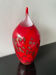 Vintage red Murano vase with gold glitter.
