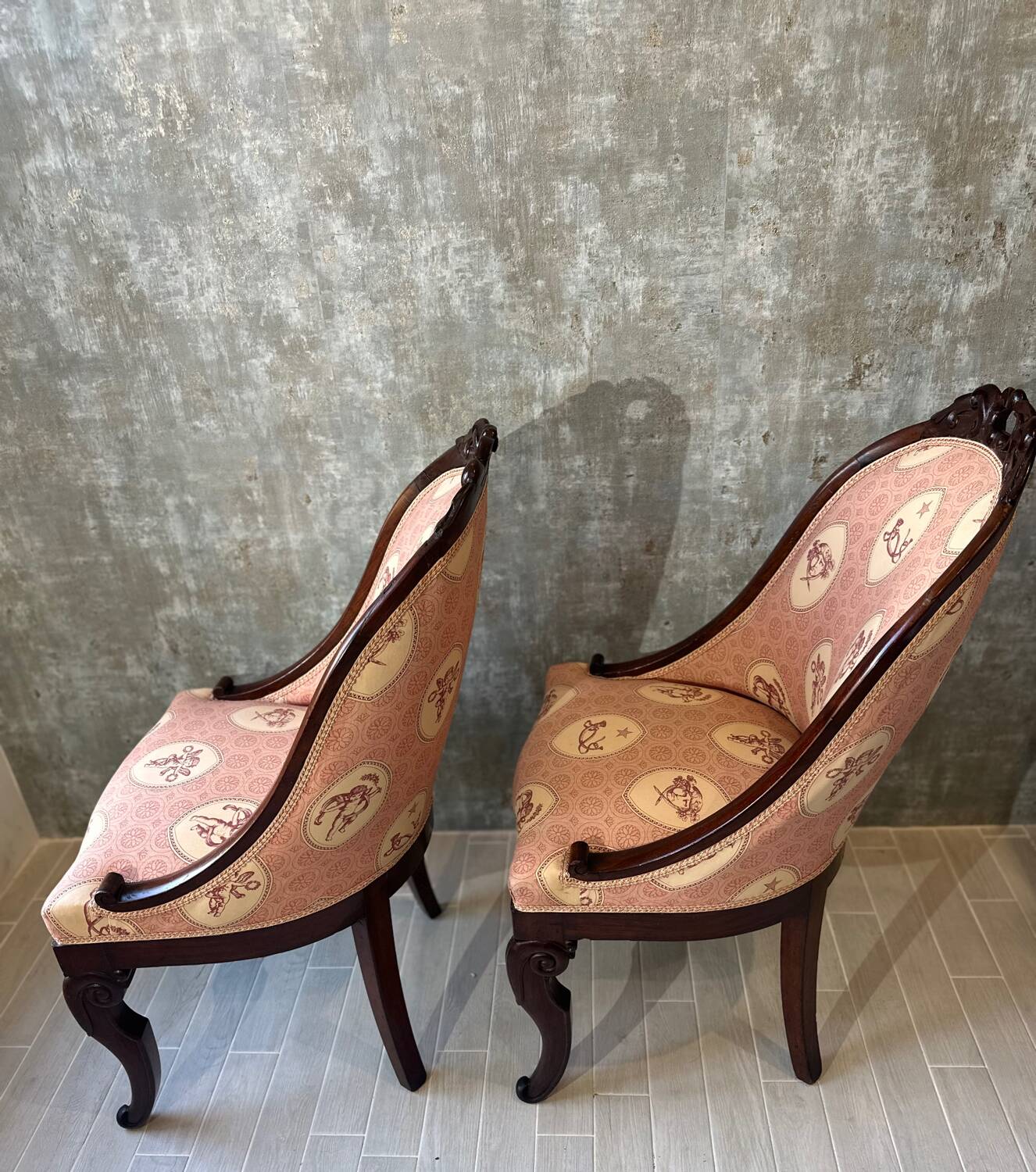 Pair of carved solid mahogany gondolas from the 19th century