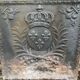 Old cast iron fireback with royal coat of arms