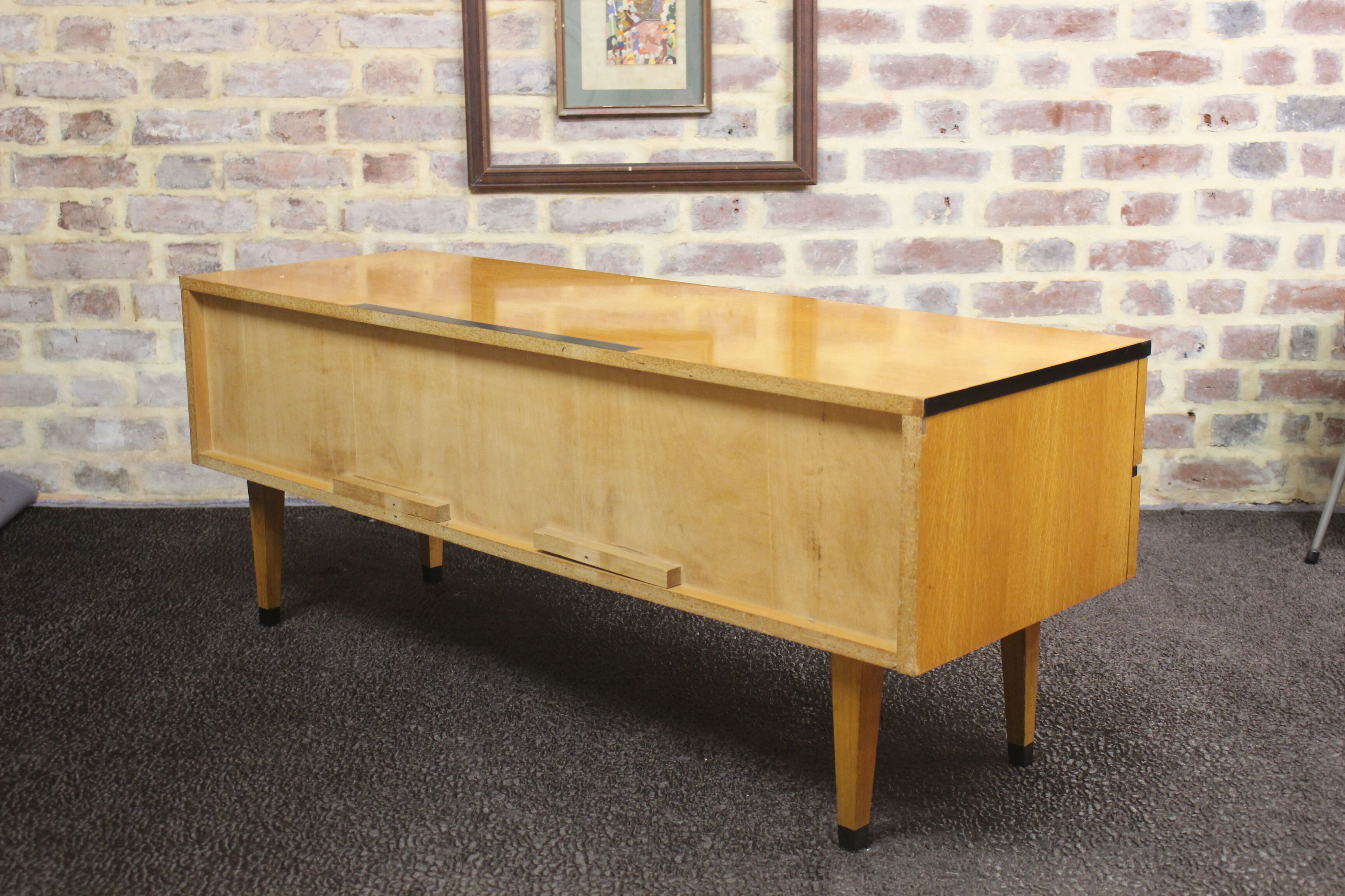 Black-gloved 50s varnished wooden sideboard