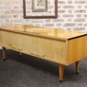 Black-gloved 50s varnished wooden sideboard