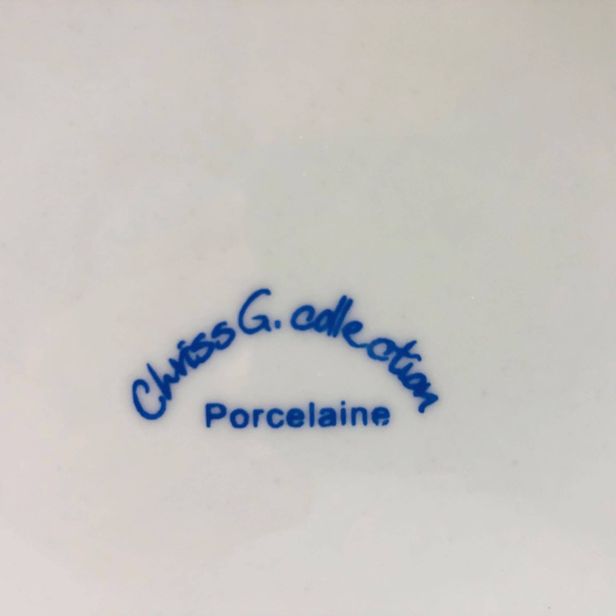 6 “Chriss G. Collection” porcelain dessert plates.