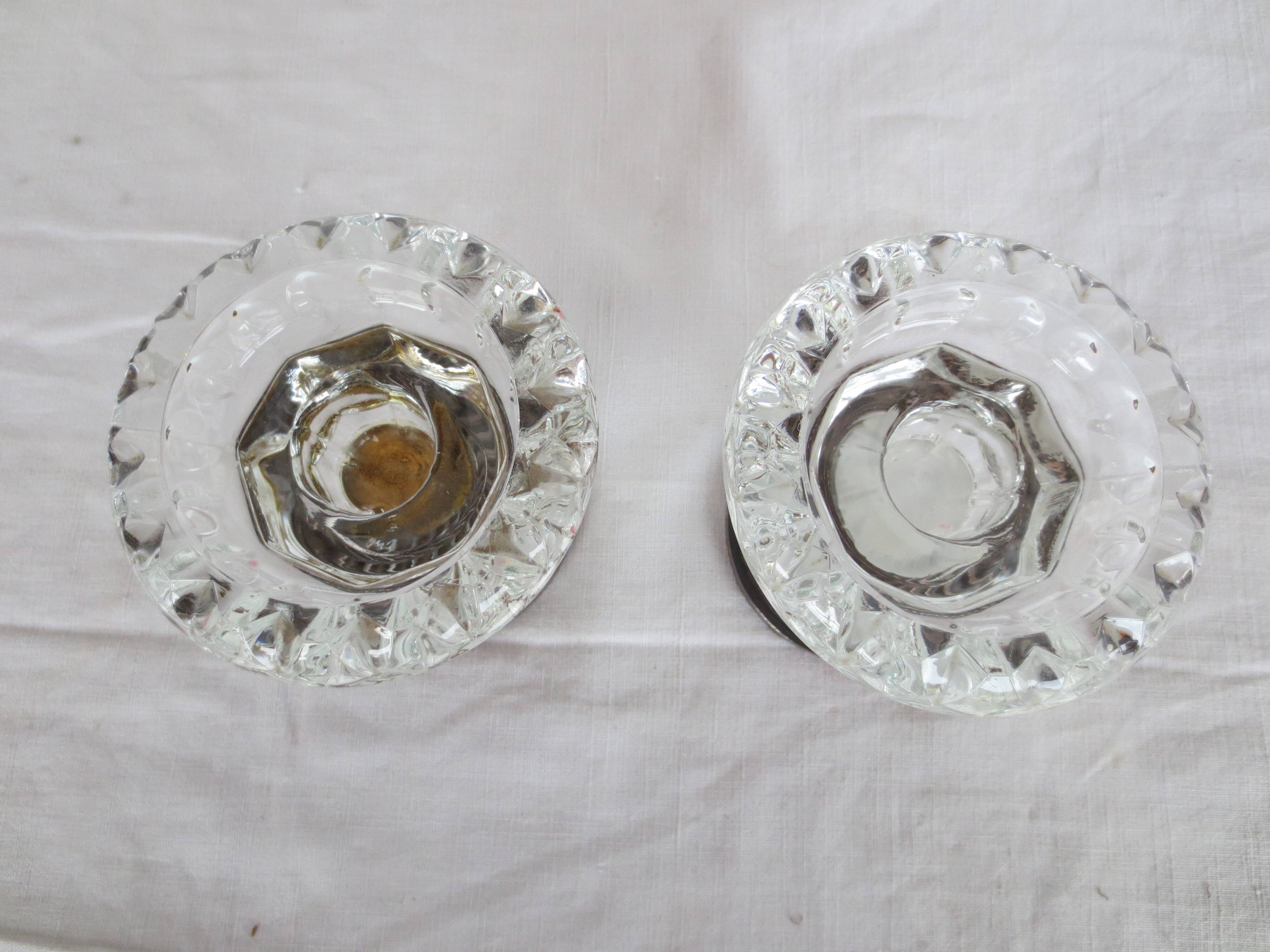 Two candle holders in bronze and crystal
