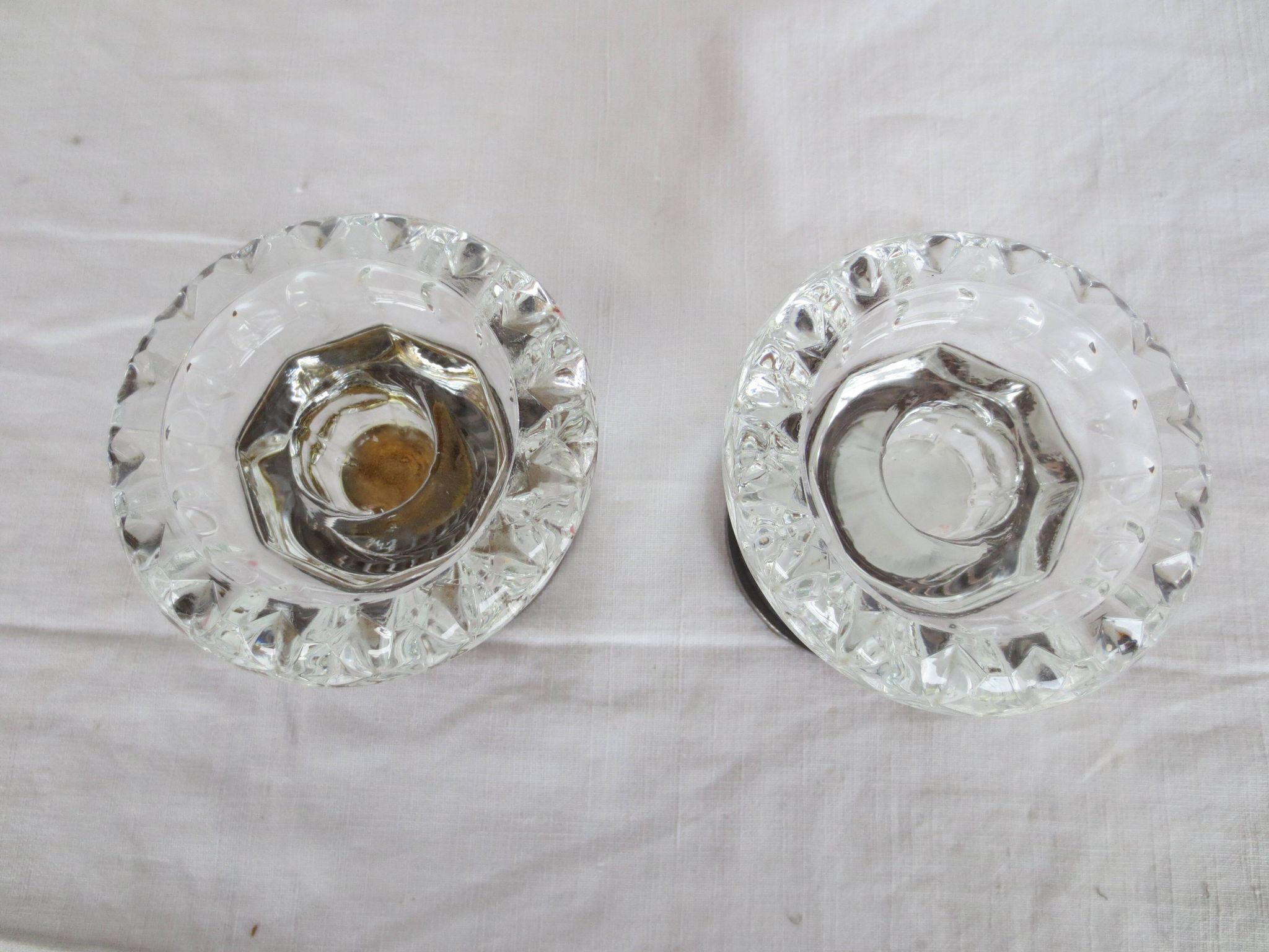 Two candle holders in bronze and crystal