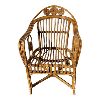 Wicker armchair with medallions