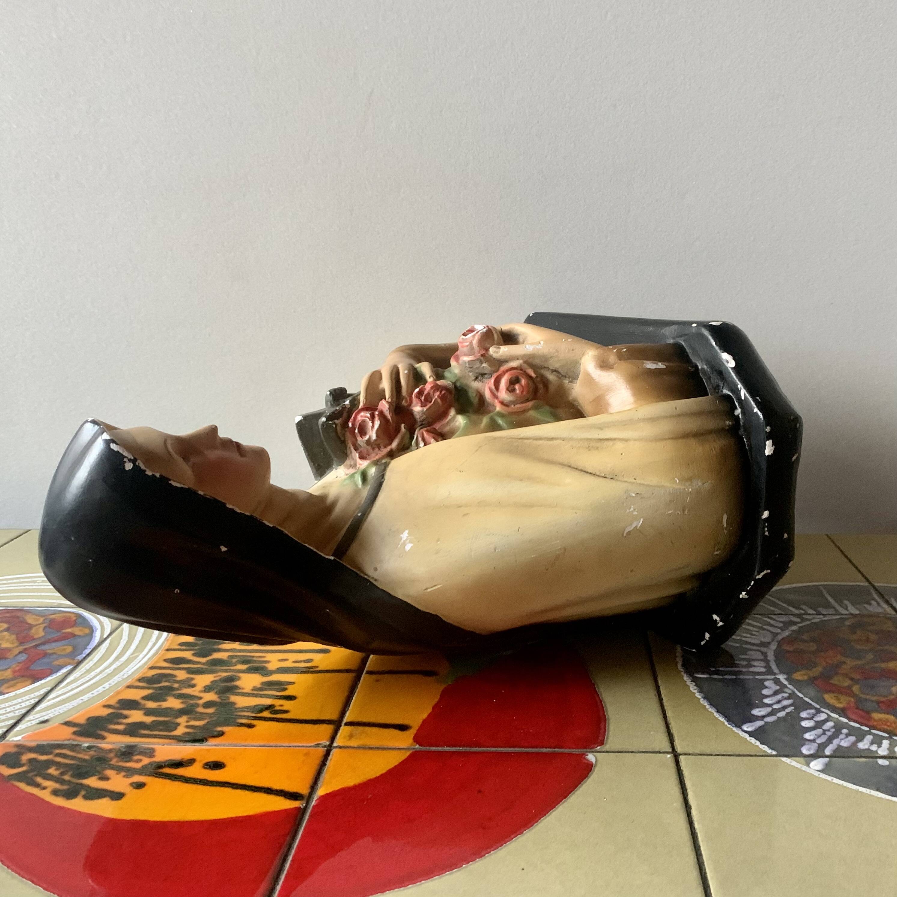 Old plaster bust of Saint Thérèse of Lisieux