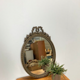 Vintage wooden mirror with arch and flowers