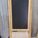 19th-century gilded trumeau mirror with restaurant slate.