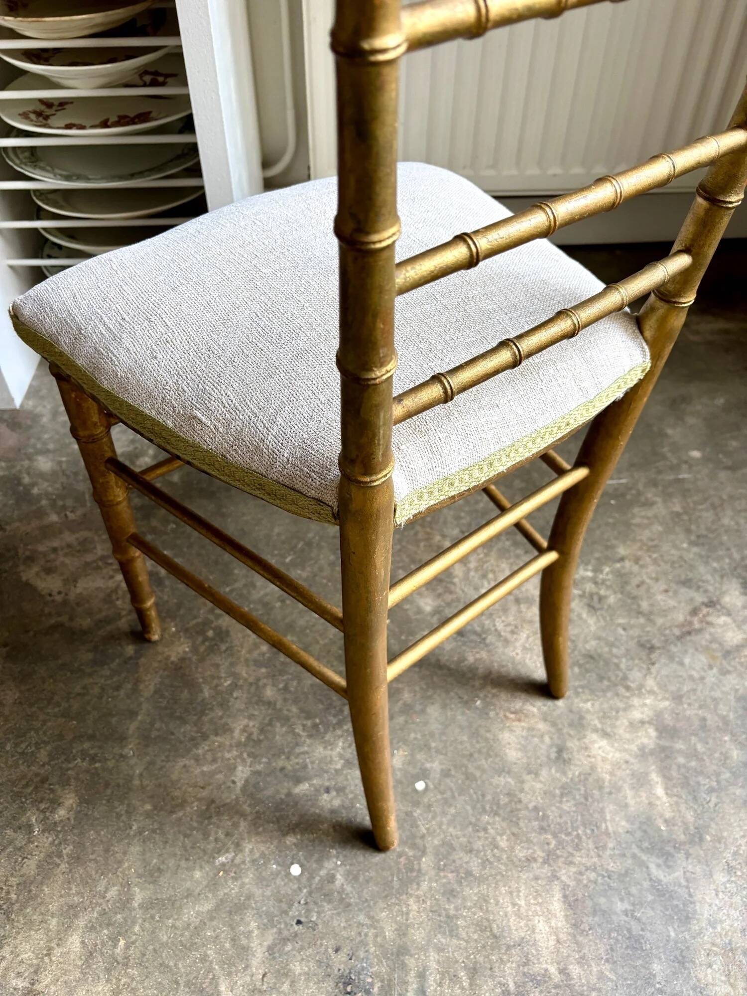 Napoleon III chair in gilded bamboo wood and beige cotton.