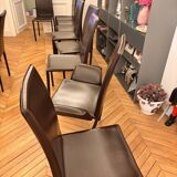 Many brown leather chairs "Roche Bobois"
