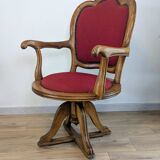 Vintage captain's chair in wood and garnet fabric — a seat with character