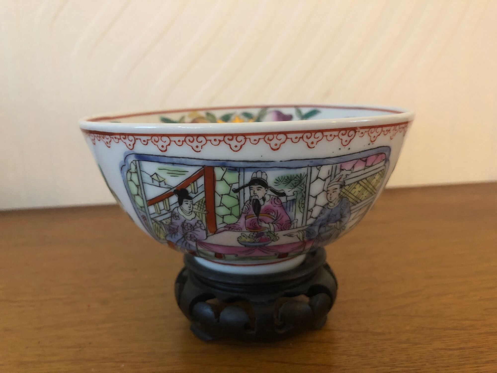 Chinese porcelain bowl on wooden base