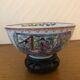 Chinese porcelain bowl on wooden base