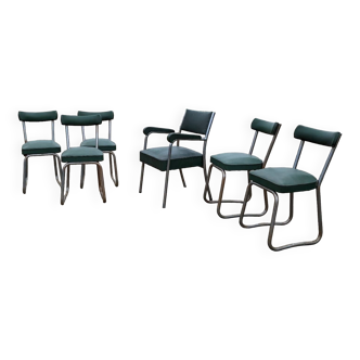 Series of chairs and a vintage industrial green skai armchair