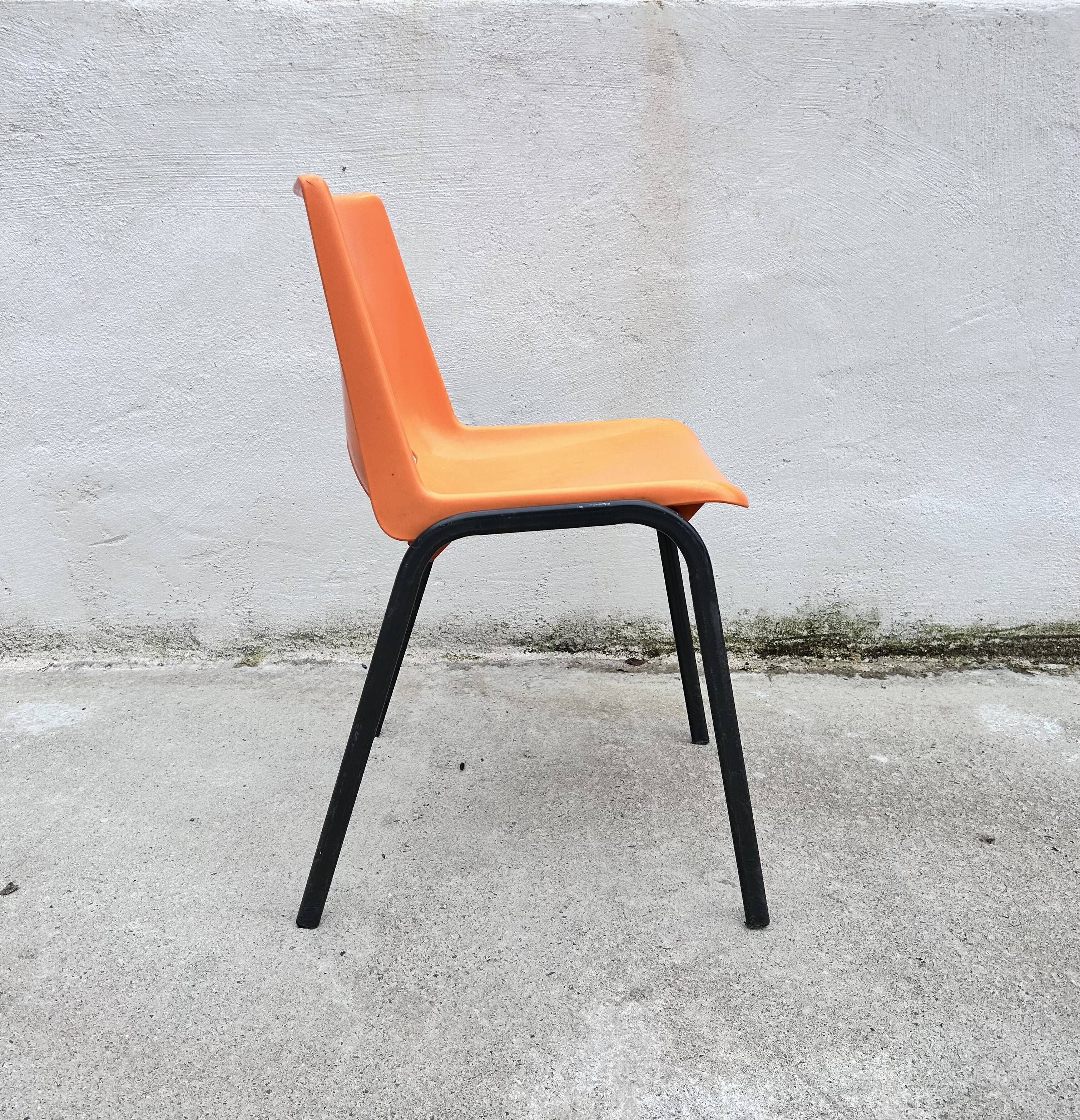 Orange plastic shell chair