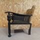 Old armchair upholstered in velvet, carved and caned wood
