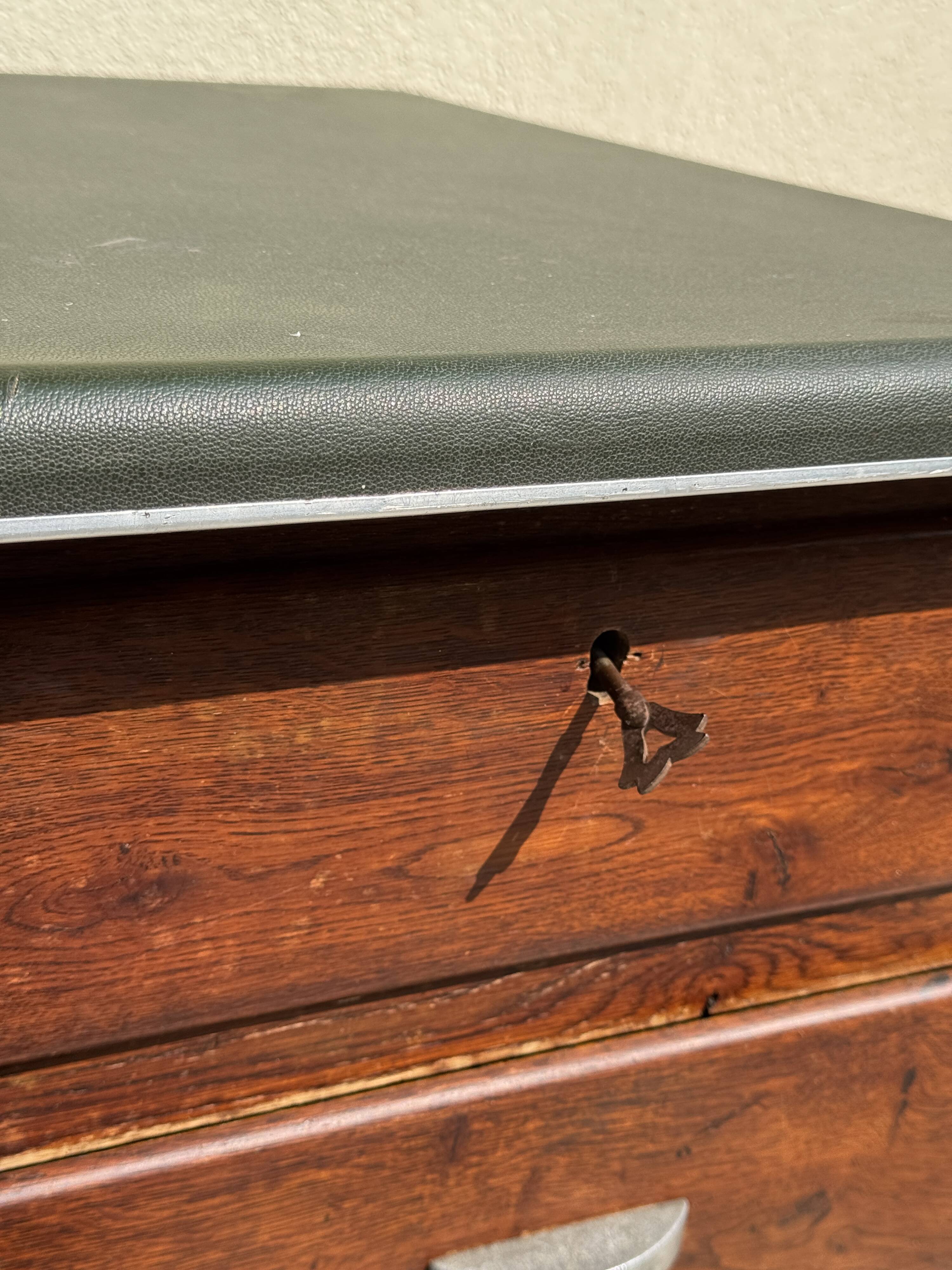 Modernist desk in wood and green moleskin upholstery