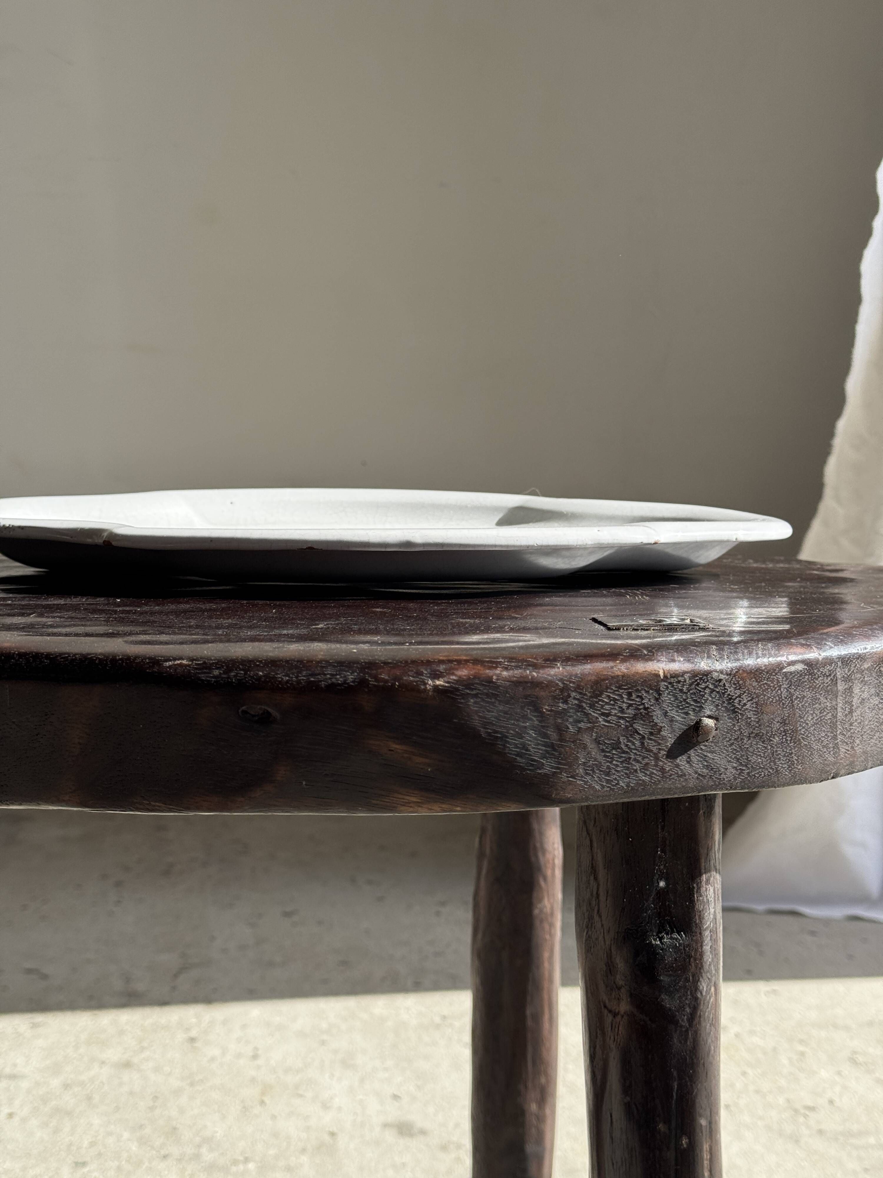 Antique oval-shaped white crackled faience plate with a scalloped edge.