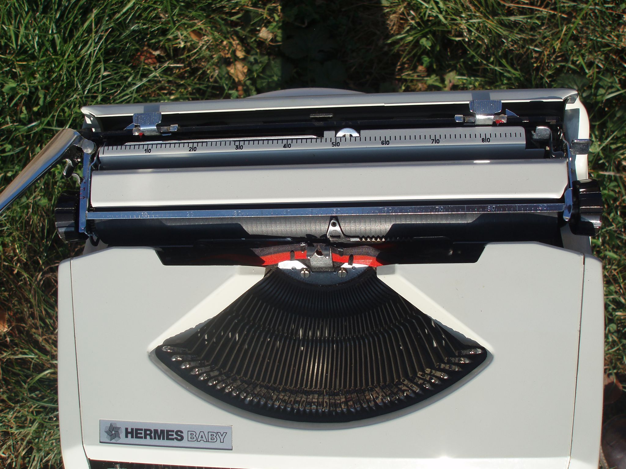Baby hermes typewriter with manual job and his bag