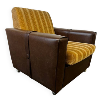 Vintage brown / ochre armchair / a chair on wheels