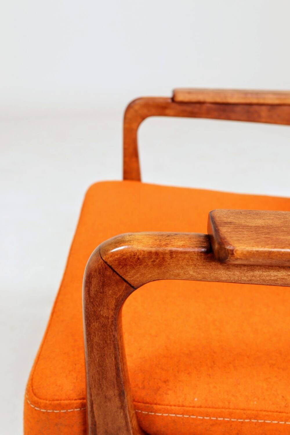 Vintage armchair in papaya orange wool from the 1960s.