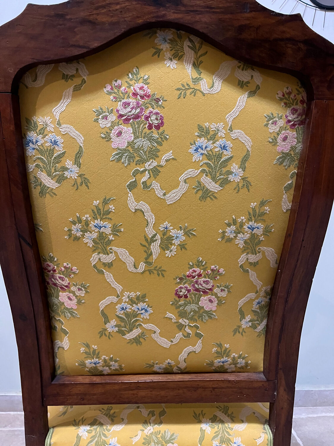 Louis XV style cabriolet armchair in solid wood, yellow floral fabric.