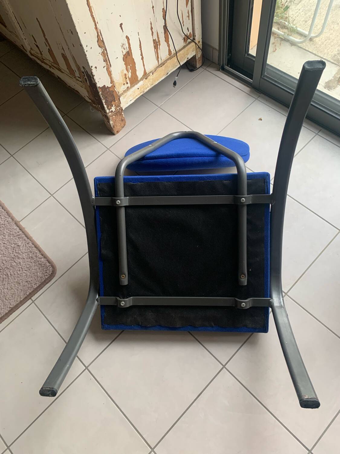 Black metal design armchair with blue fabric. 1980s.
