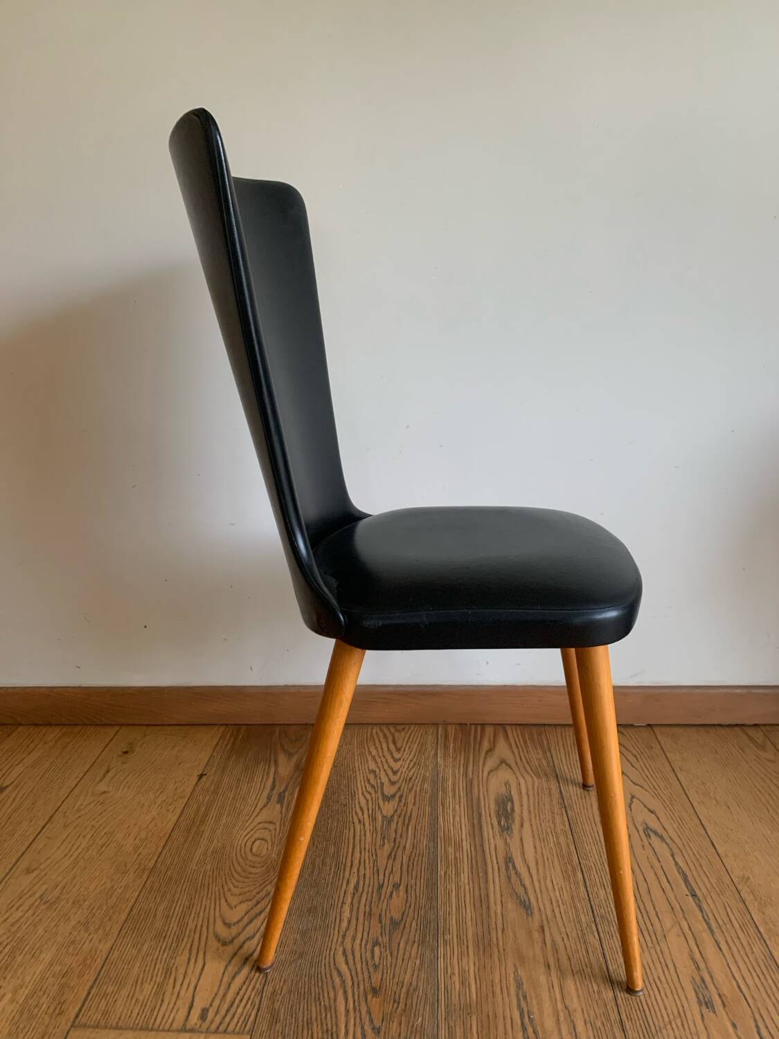 Black chair with compass legs