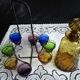 Old Italian alcohol decanter and its colorful glasses