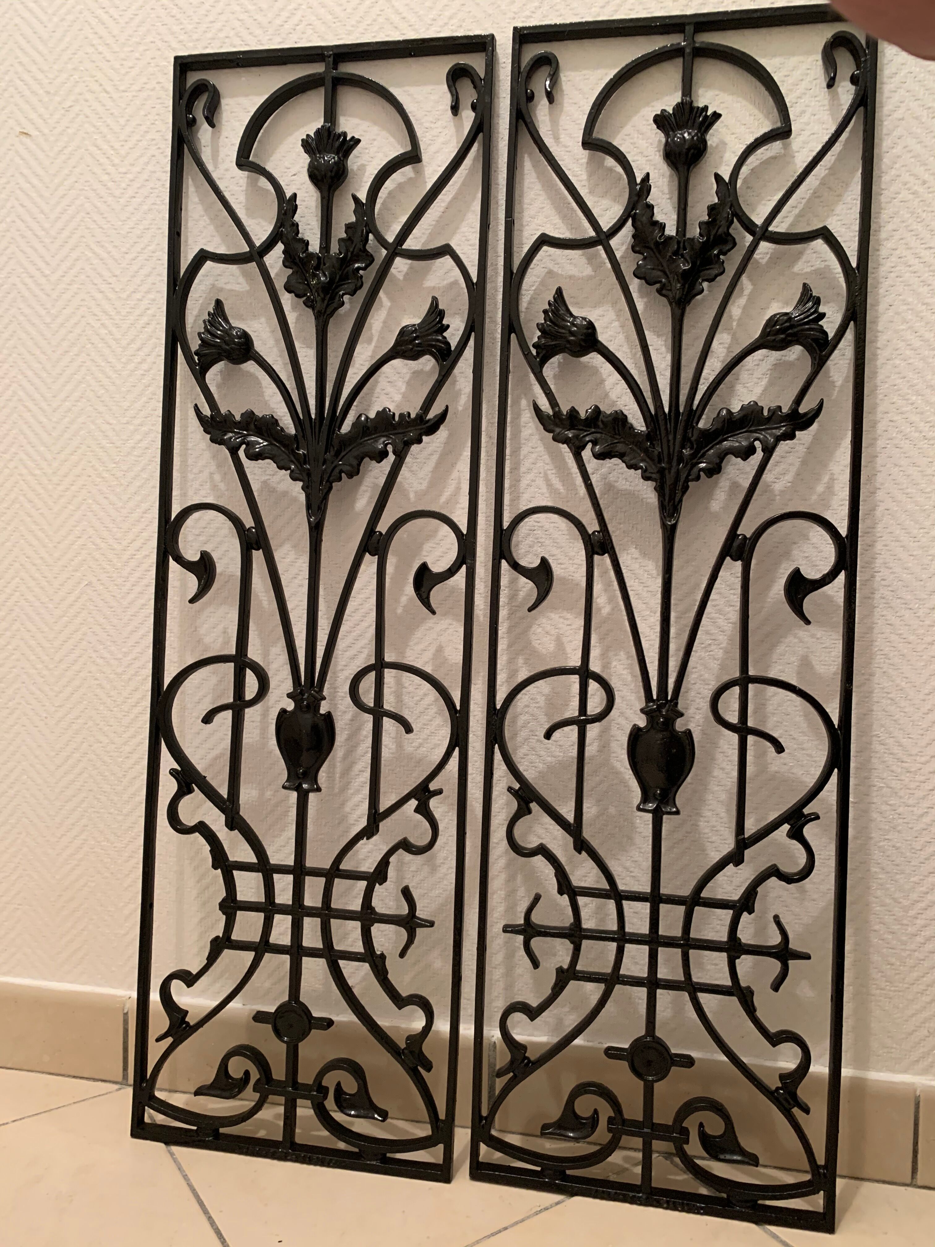 2 Art Nouveau ironwork grids decorated with inopuly or blueberry decoration