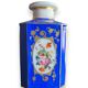 Perfume bottle in porcelain of old paris blue background