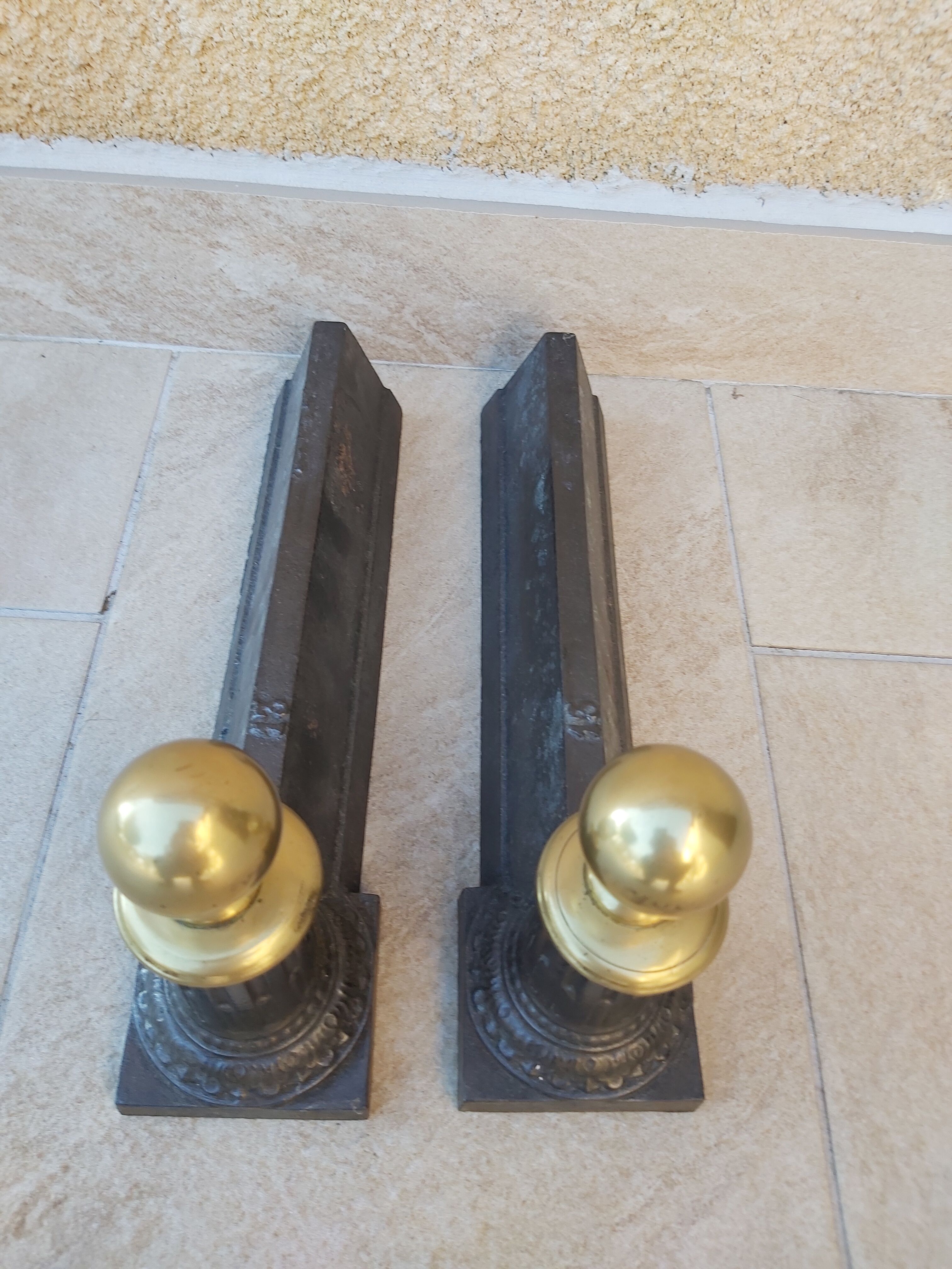 Pair of cast iron and bronze chenets