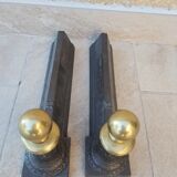 Pair of cast iron and bronze chenets