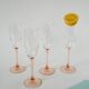 Set of 4 champagne flutes with pink feet, 1970