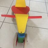 Colourful wooden 4-wheeled cycle. End of the 1970s.