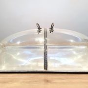 Large serving platter with lid, in silver metal.