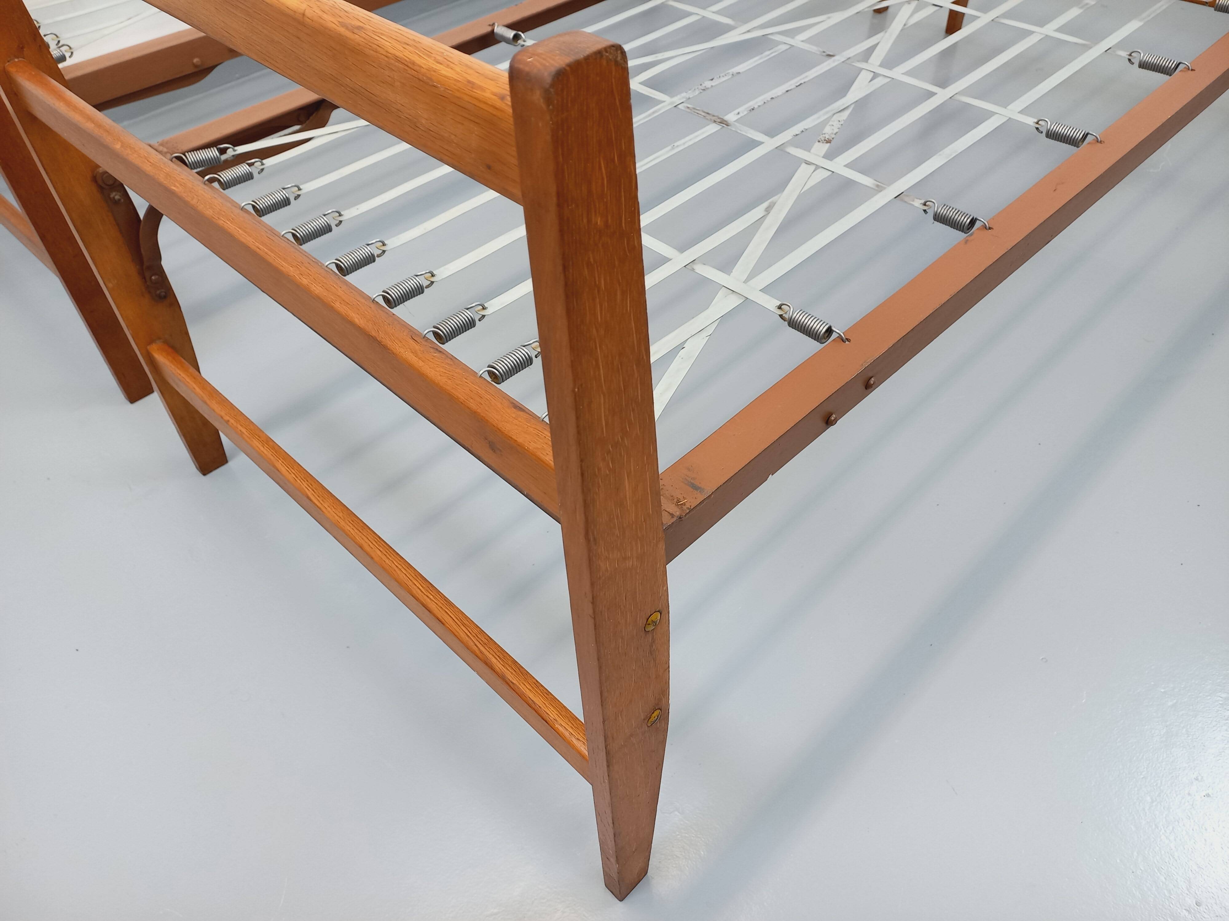 Pair of vintage stackable daybeds in oak wood and metal from the 60s