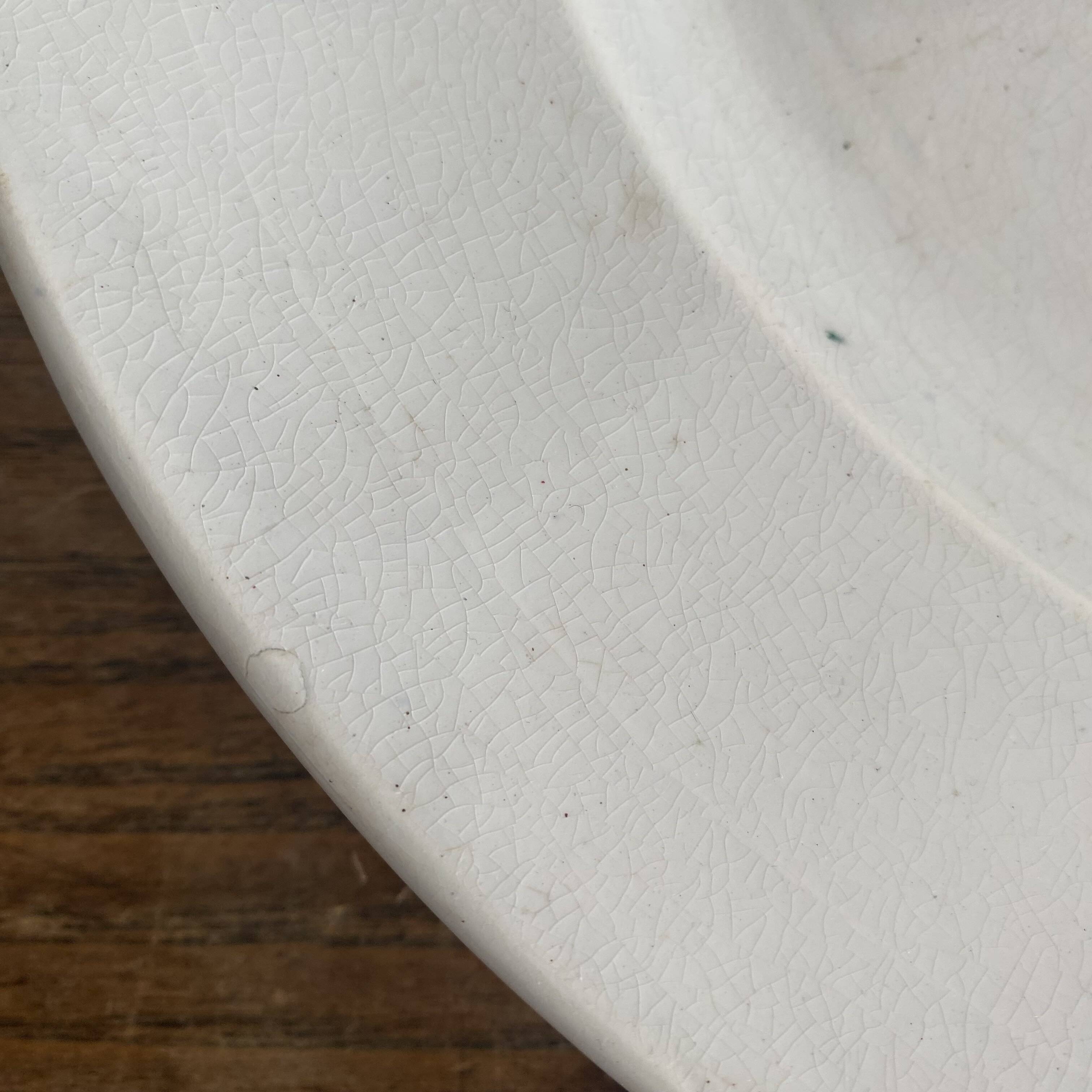 Set of large round white earthenware dishes from Creil and Montereau, 19th century