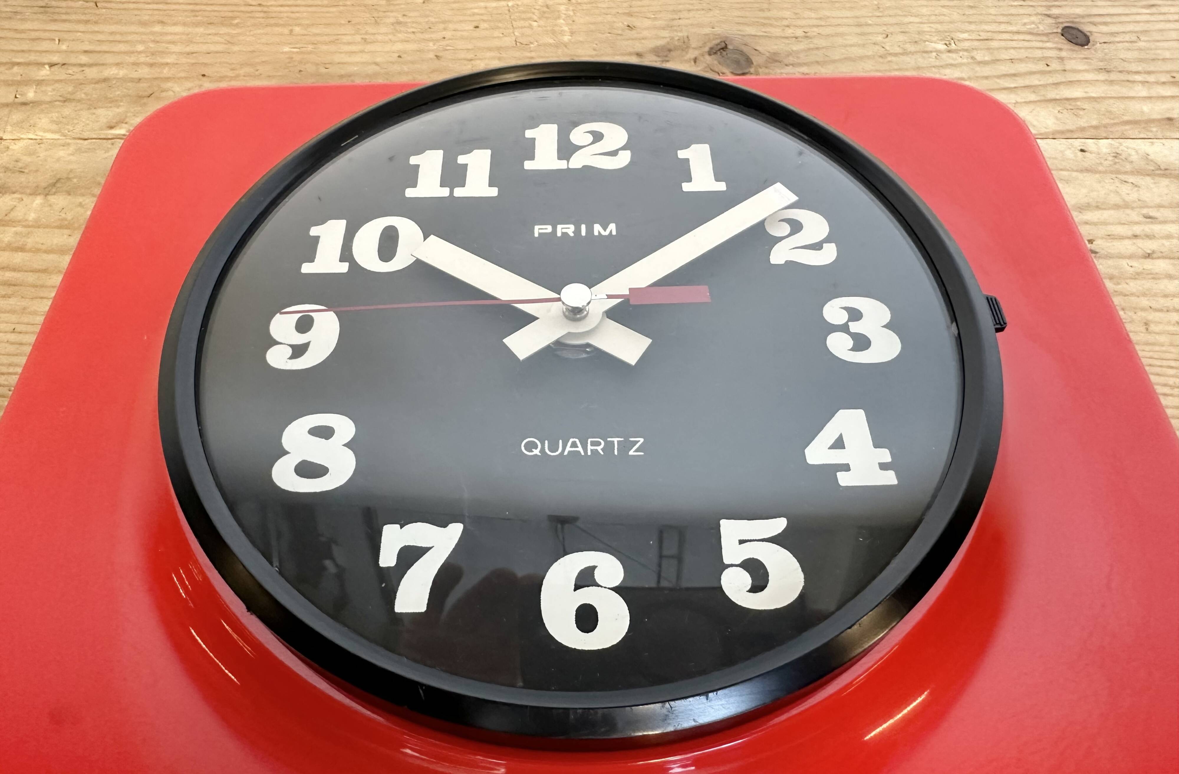 Vintage red bakelite wall clock from prim, 1970s