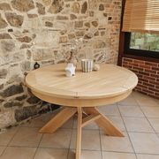 Round table in the style of Pierre Chapo.