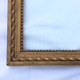 Gilded wooden frame and its glass