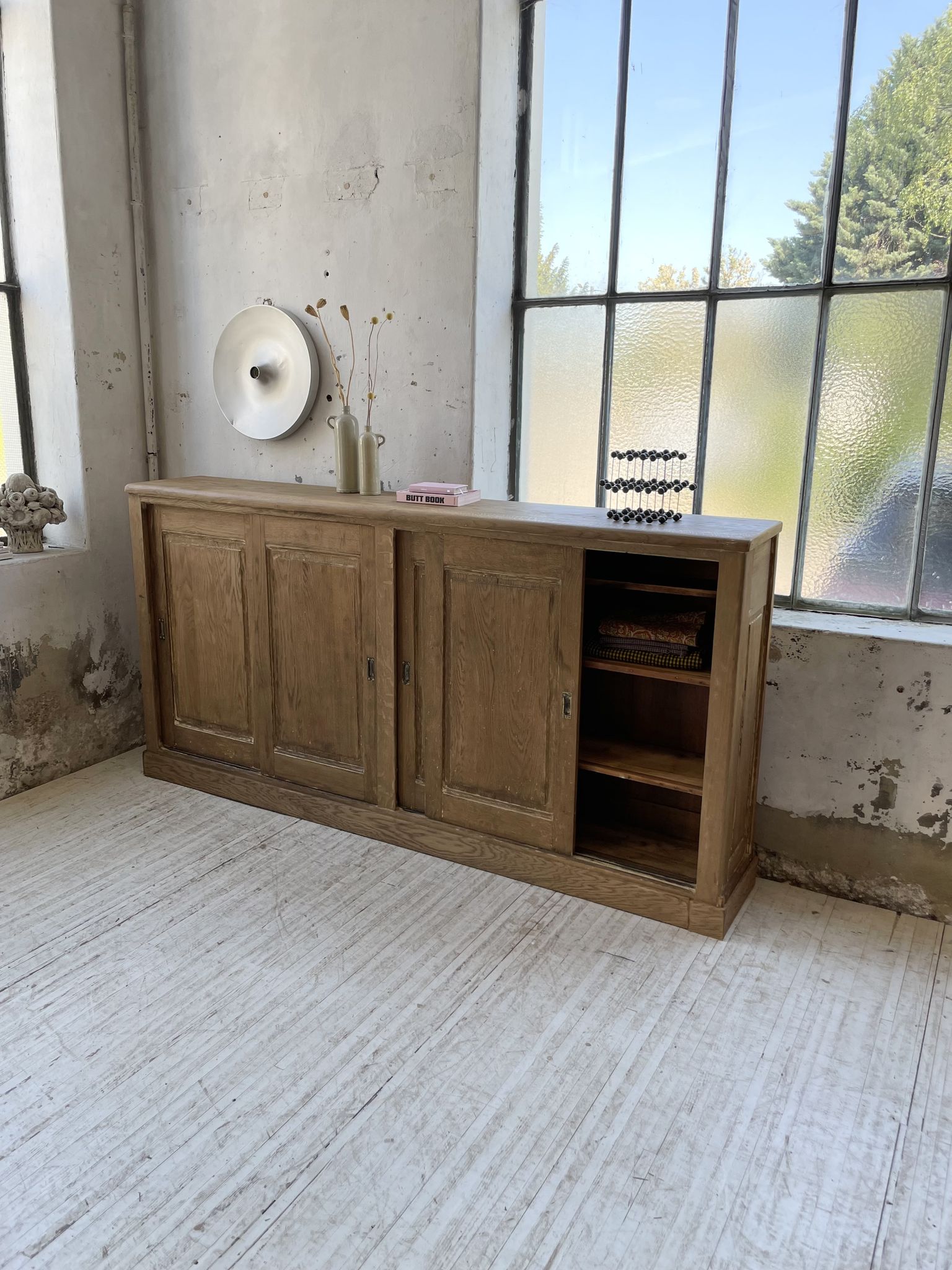 Large row of solid oak loom sliding doors